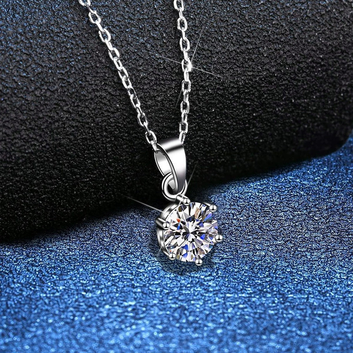 Round Moissanite Pendant Necklace in White Gold-Plated S925 Sterling Silver blue background product view