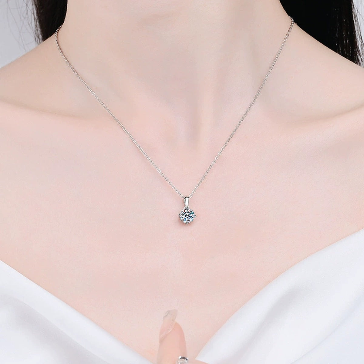 Round Moissanite Solitaire Pendant Necklace in Platinum-Plated S925 Sterling Silver worn on neckline by model