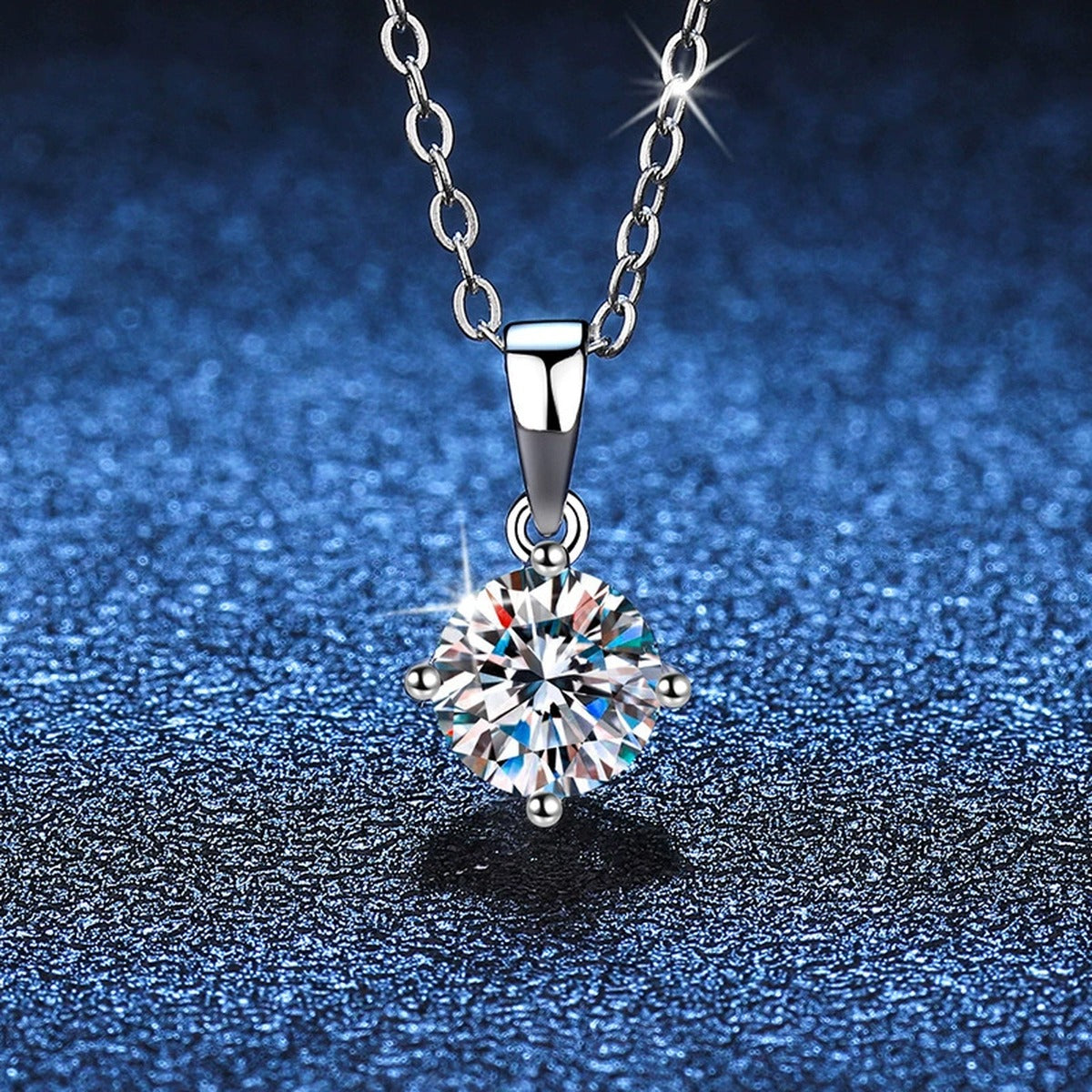 Round Moissanite Solitaire Pendant Necklace in Platinum-Plated S925 Sterling Silver blue background angled detail view