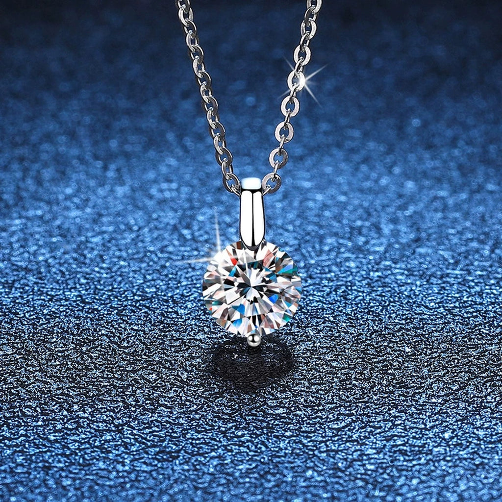 Round Moissanite Solitaire Pendant Necklace in Platinum-Plated S925 Sterling Silver blue background product view