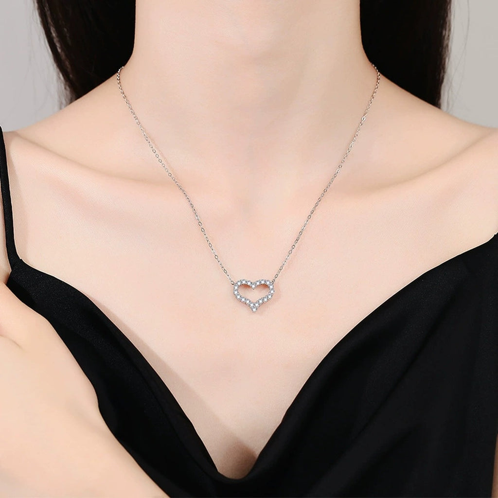Heart Moissanite Pendant Necklace in White Gold-Plated S925 Sterling Silver worn on neckline by model
