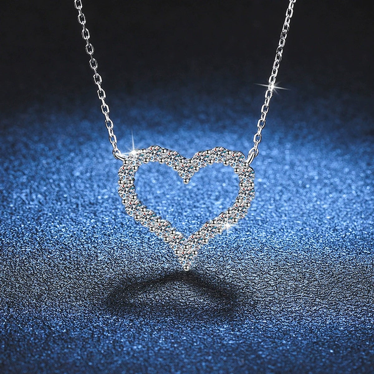 Heart Moissanite Pendant Necklace in White Gold-Plated S925 Sterling Silver blue background product view