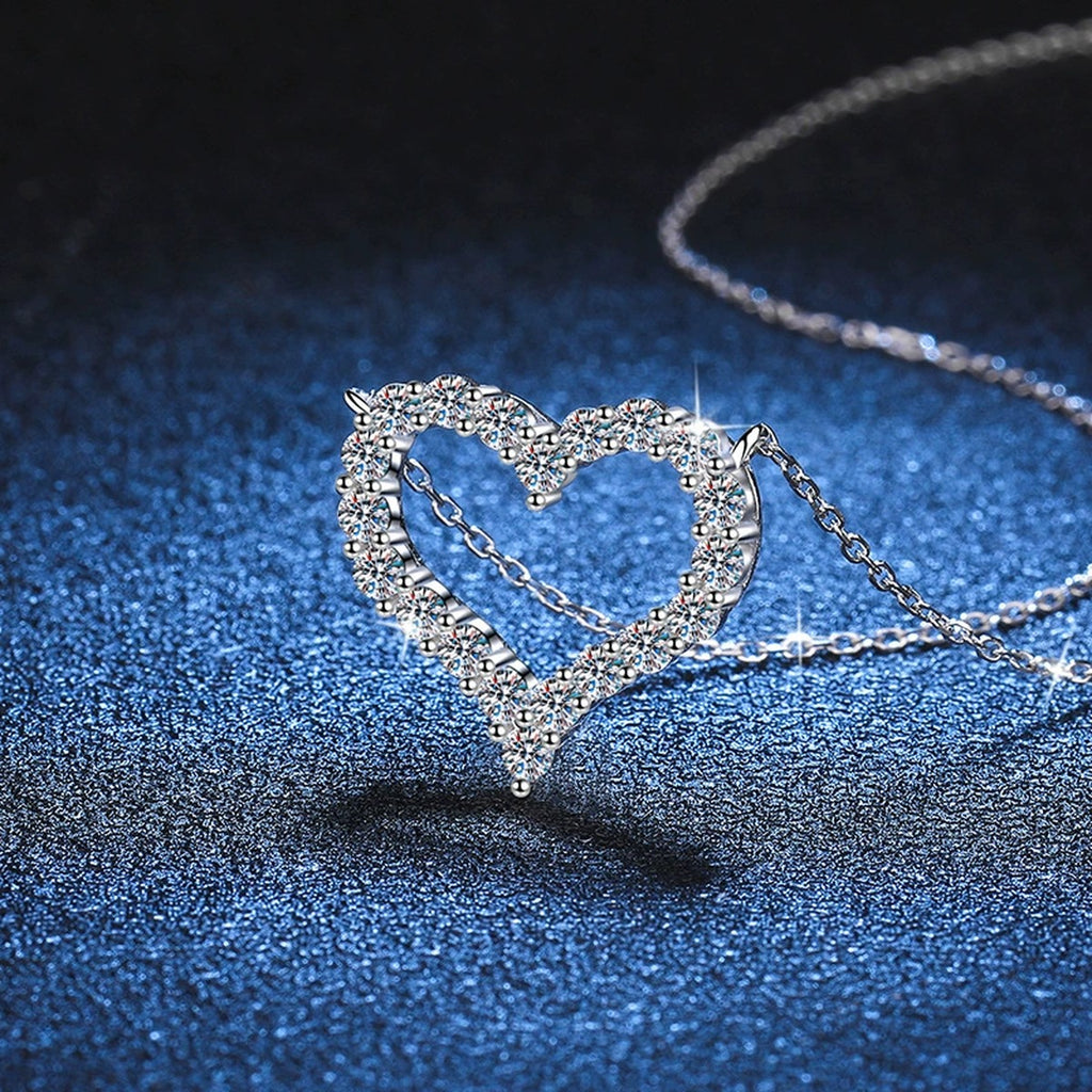Heart Moissanite Pendant Necklace in White Gold-Plated S925 Sterling Silver blue background angled view