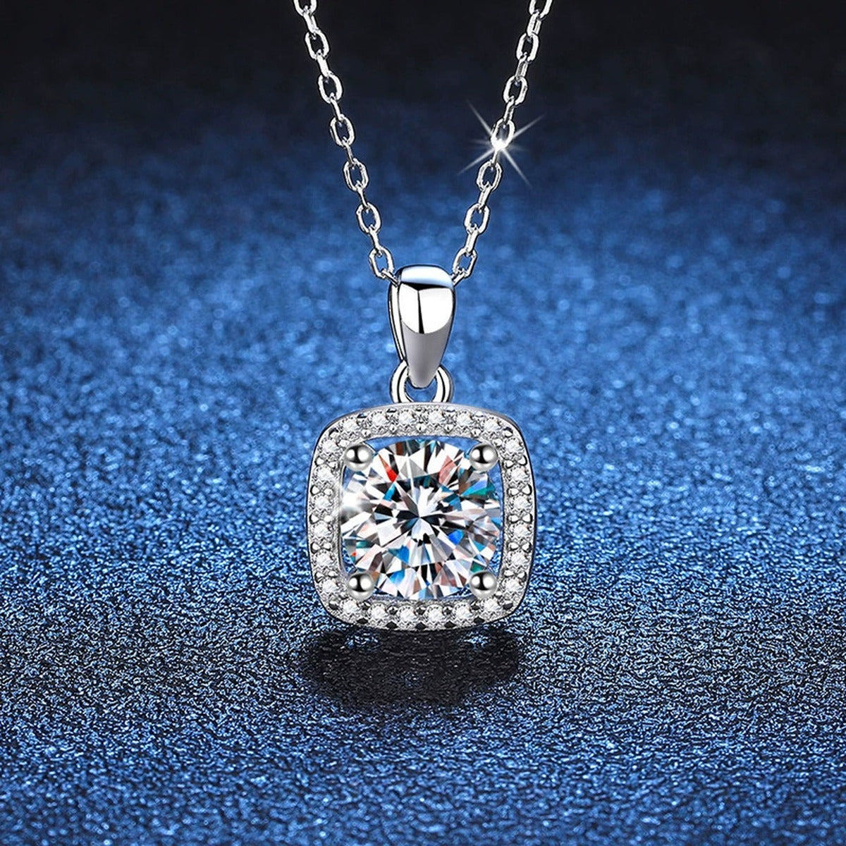 Round Moissanite Pendant Necklace in Platinum-Plated S925 Sterling Silver blue background close-up view