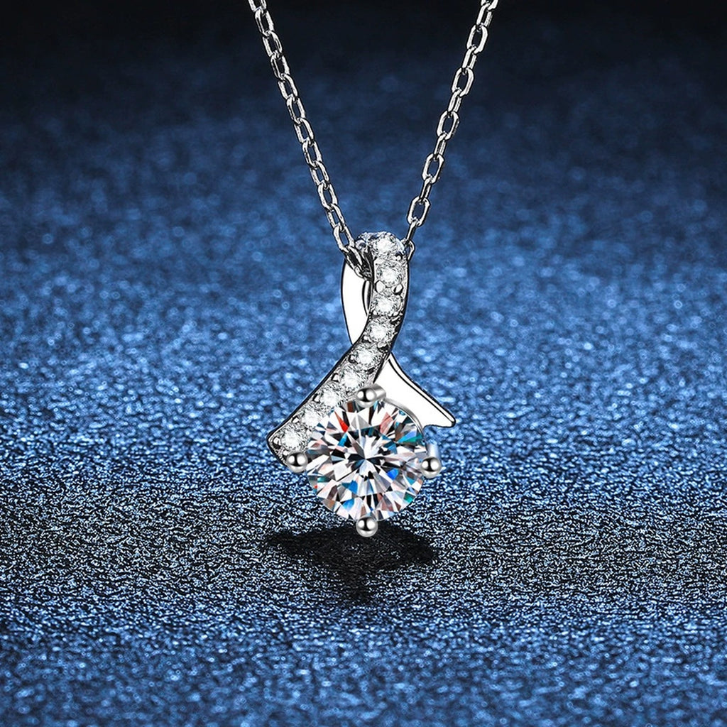 Ribbon Round Moissanite Pendant Necklace in Platinum-Plated S925 Sterling Silver blue background angled detail view