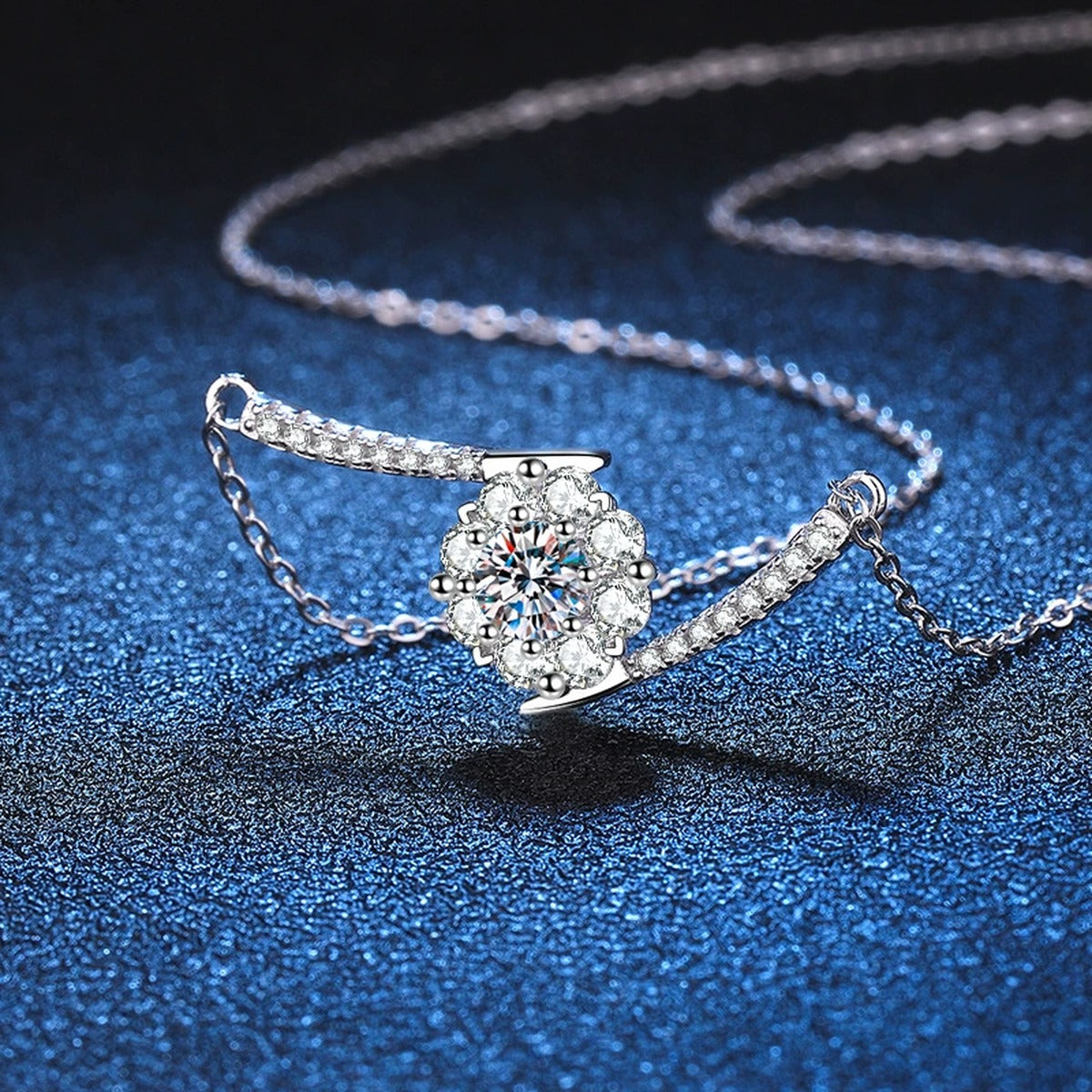 Curved Bar Moissanite Necklace in Platinum-Plated S925 Sterling Silver blue background angled detail view