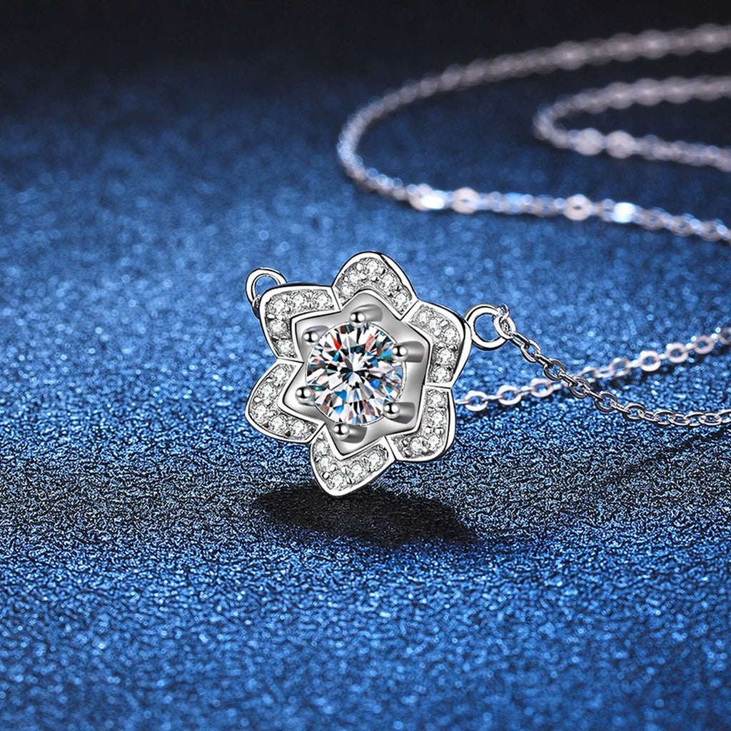 Floral Halo Moissanite Pendant Necklace in Platinum-Plated S925 Sterling Silver blue background angled detail view