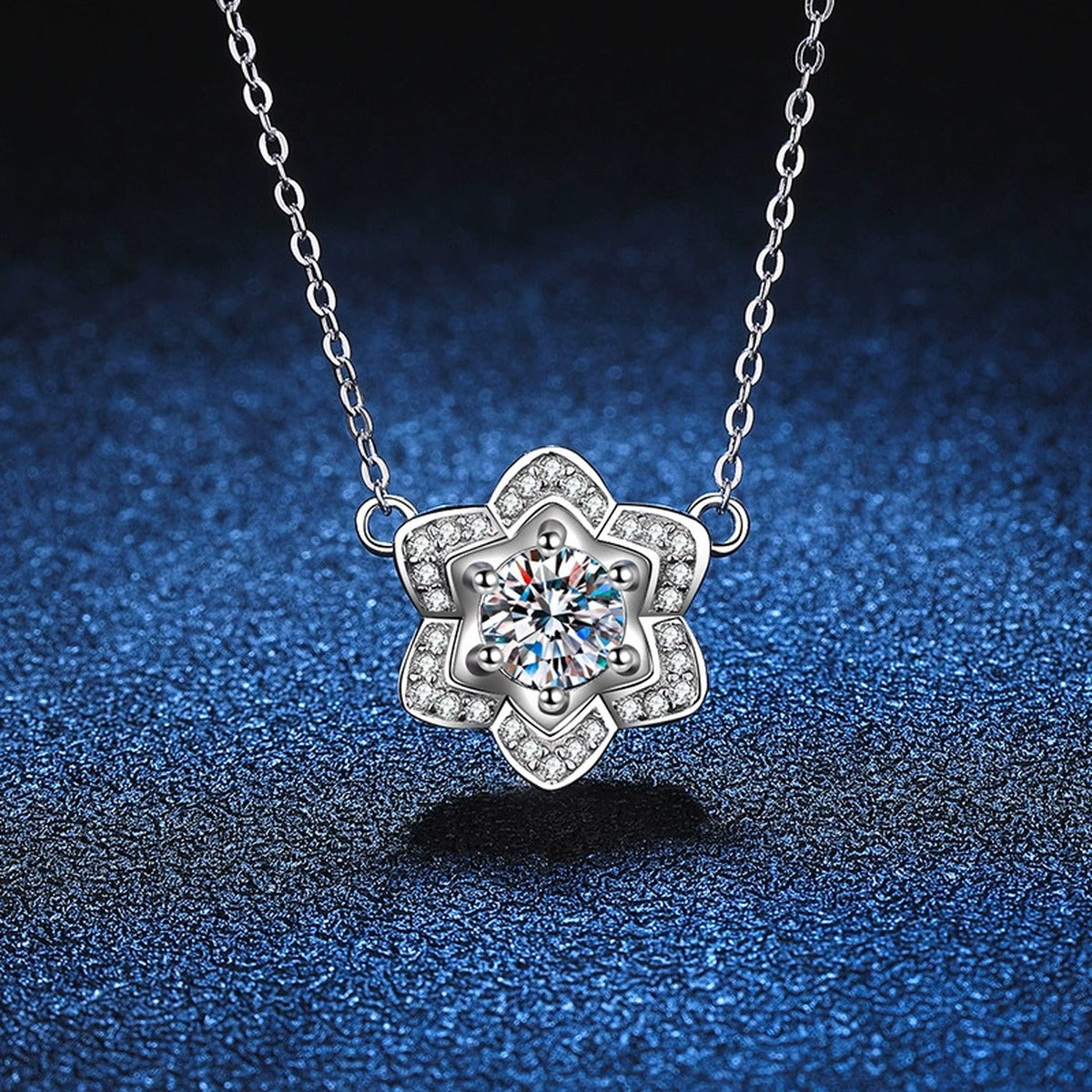 Floral Halo Moissanite Pendant Necklace in Platinum-Plated S925 Sterling Silver blue background close-up view