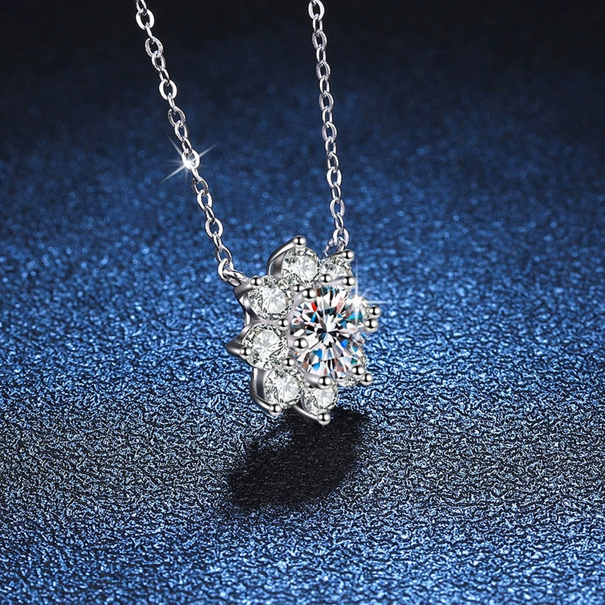 Starburst Moissanite Pendant Necklace in Platinum-Plated S925 Sterling Silver blue background close-up view