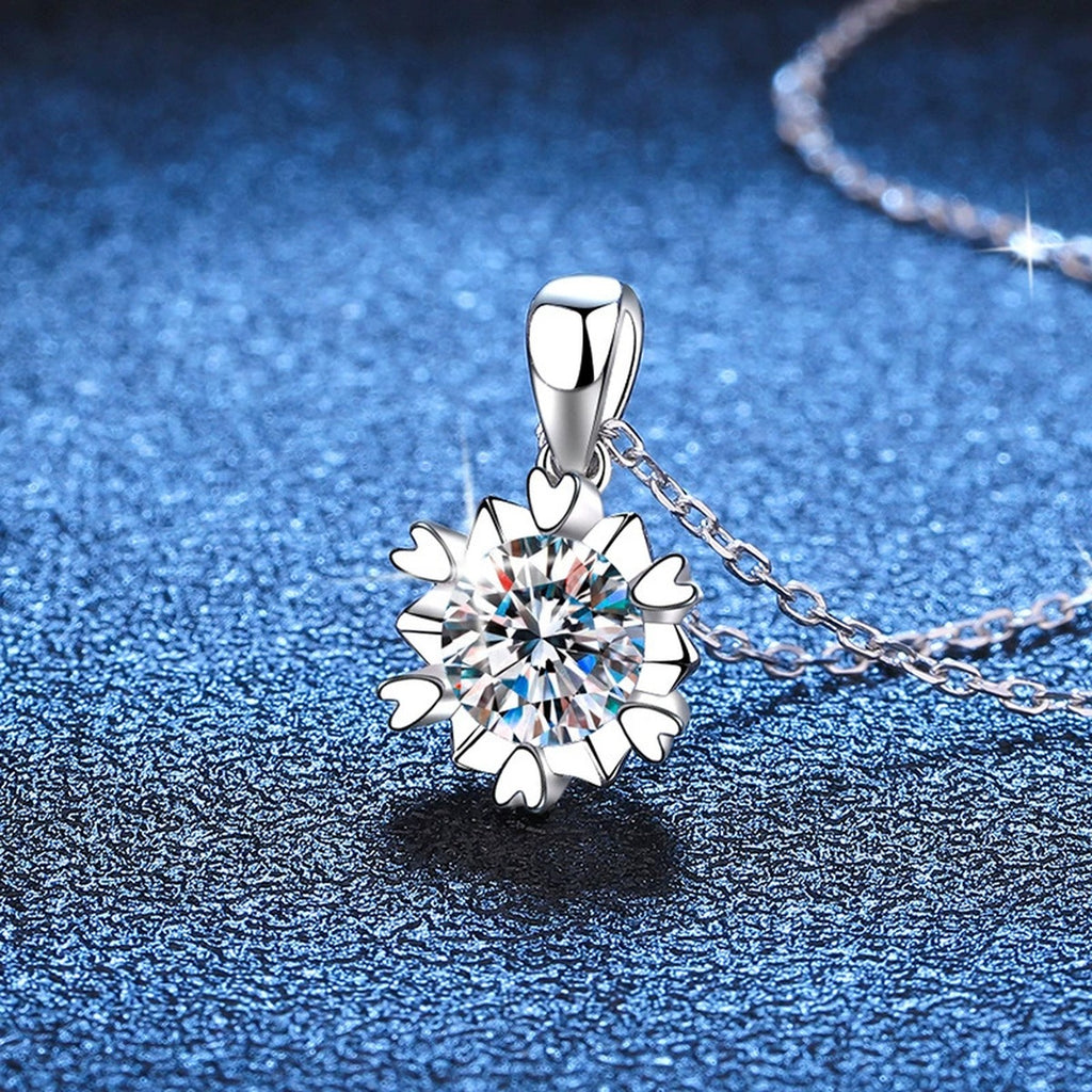 Sunburst Round Moissanite Pendant Necklace in Platinum-Plated S925 Sterling Silver blue background close-up view
