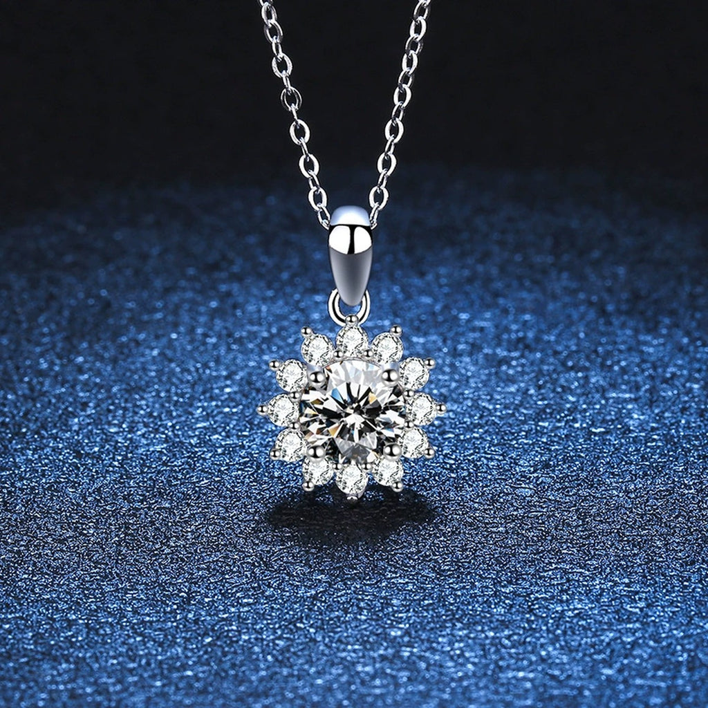 Floral Halo Moissanite Pendant Necklace in Platinum-Plated S925 Sterling Silver blue background angled detail view