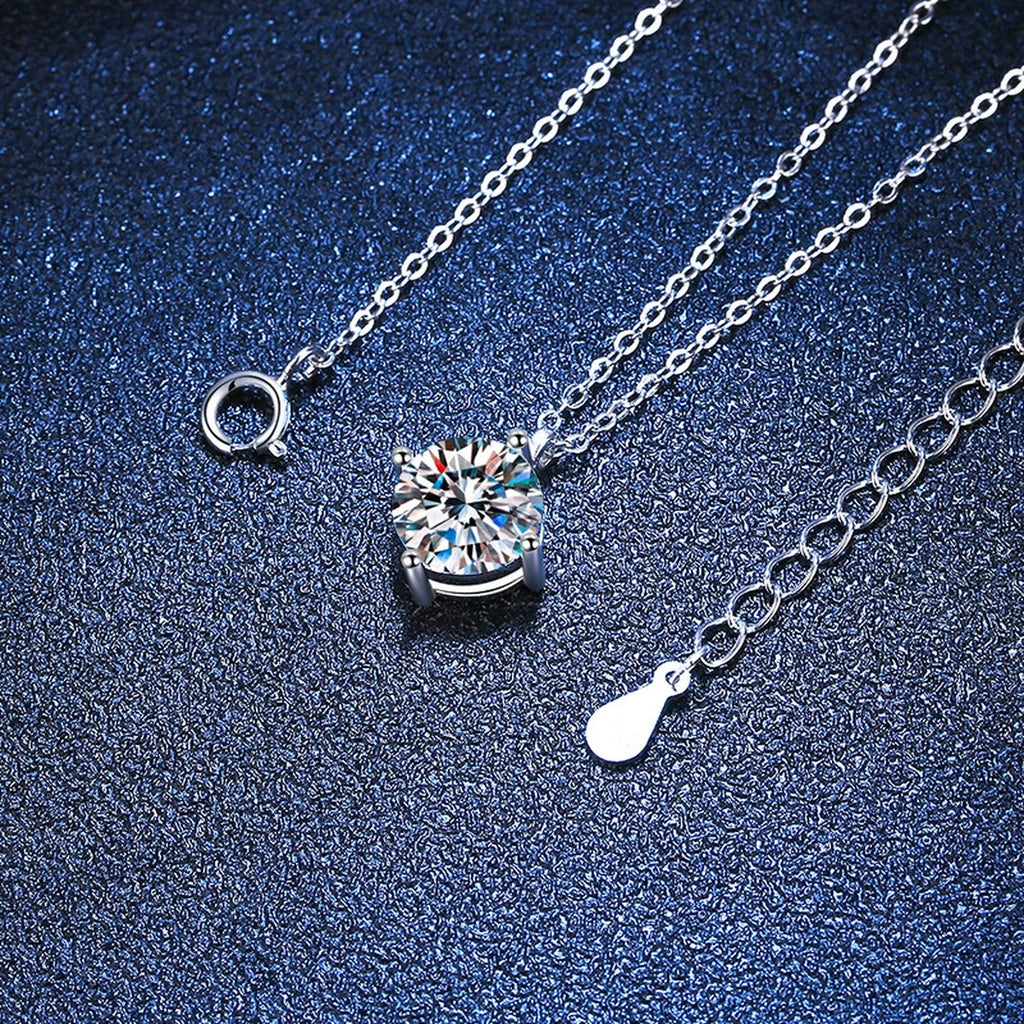 Graduated Moissanite Station Necklace in Platinum-Plated S925 Sterling Silver blue background angled detail view