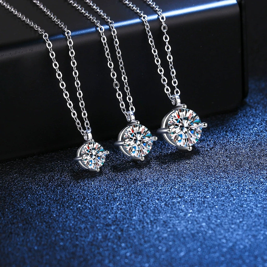 Graduated Moissanite Station Necklace in Platinum-Plated S925 Sterling Silver blue background close-up view