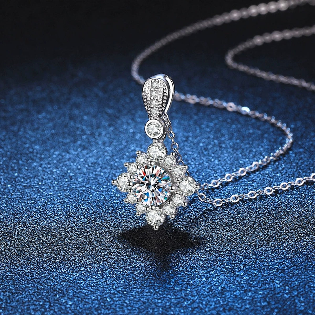 Star Halo Moissanite Pendant Necklace in Platinum-Plated S925 Sterling Silver blue background close-up view