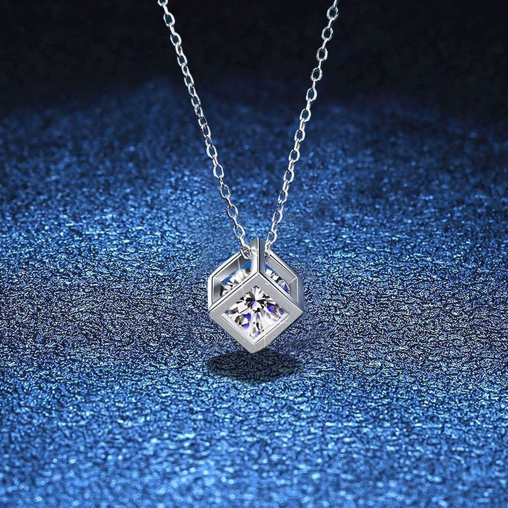 Cube Moissanite Pendant Necklace in Platinum-Plated S925 Sterling Silver blue background close-up view