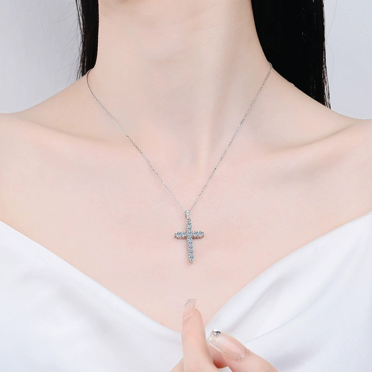 Pavé Cross Moissanite Pendant Necklace in Platinum-Plated S925 Sterling Silver worn on neckline by model