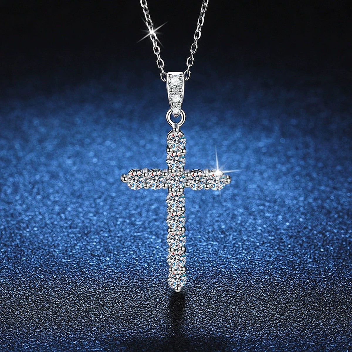 Pavé Cross Moissanite Pendant Necklace in Platinum-Plated S925 Sterling Silver blue background angled detail view