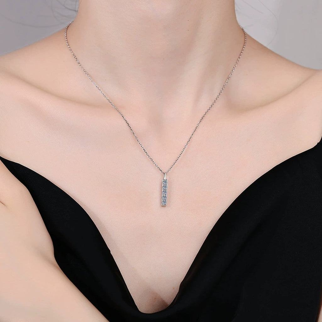 Vertical Bar Moissanite Pendant Necklace in Platinum-Plated S925 Sterling Silver worn by model at neckline