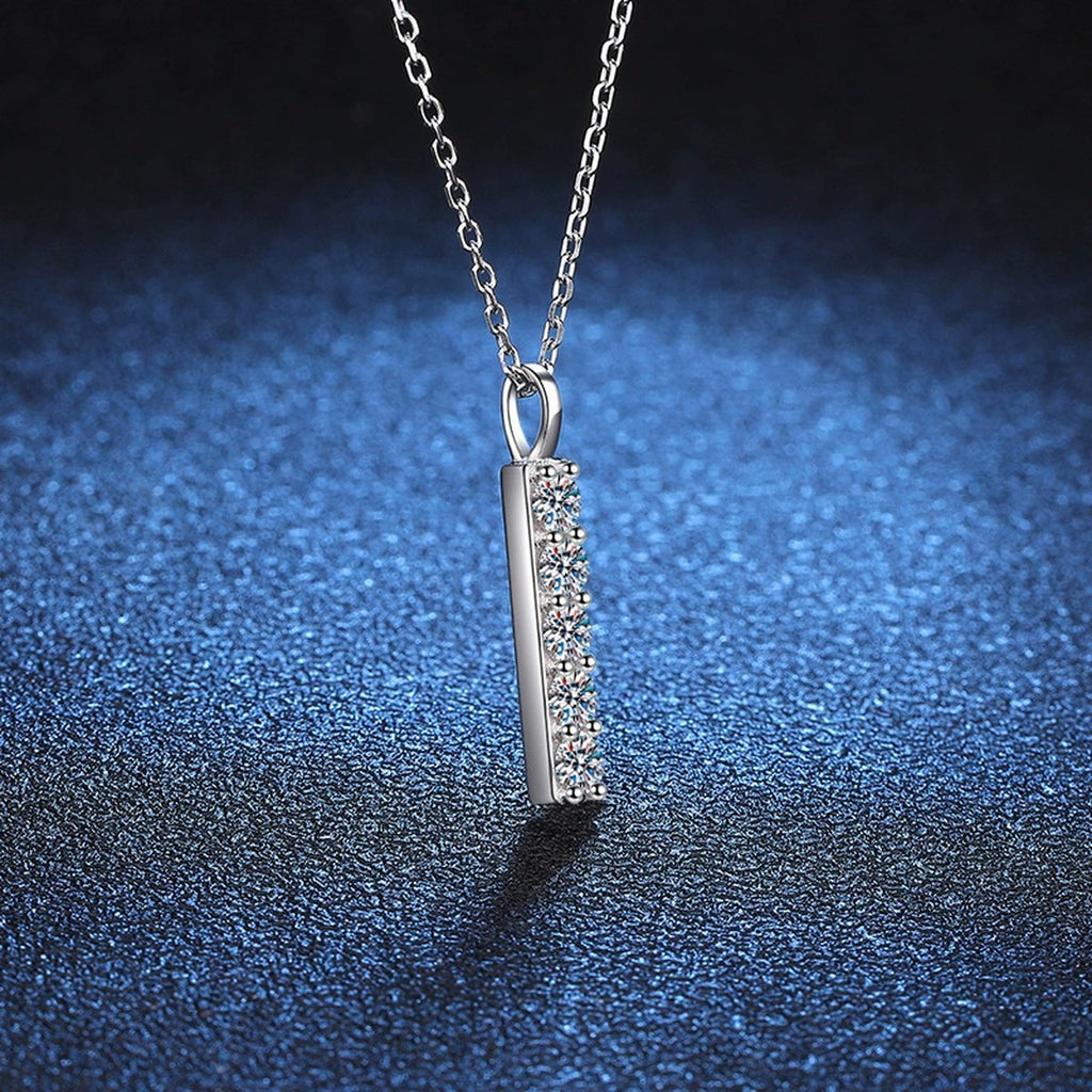 Vertical Bar Moissanite Pendant Necklace in Platinum-Plated S925 Sterling Silver blue background angled detail view