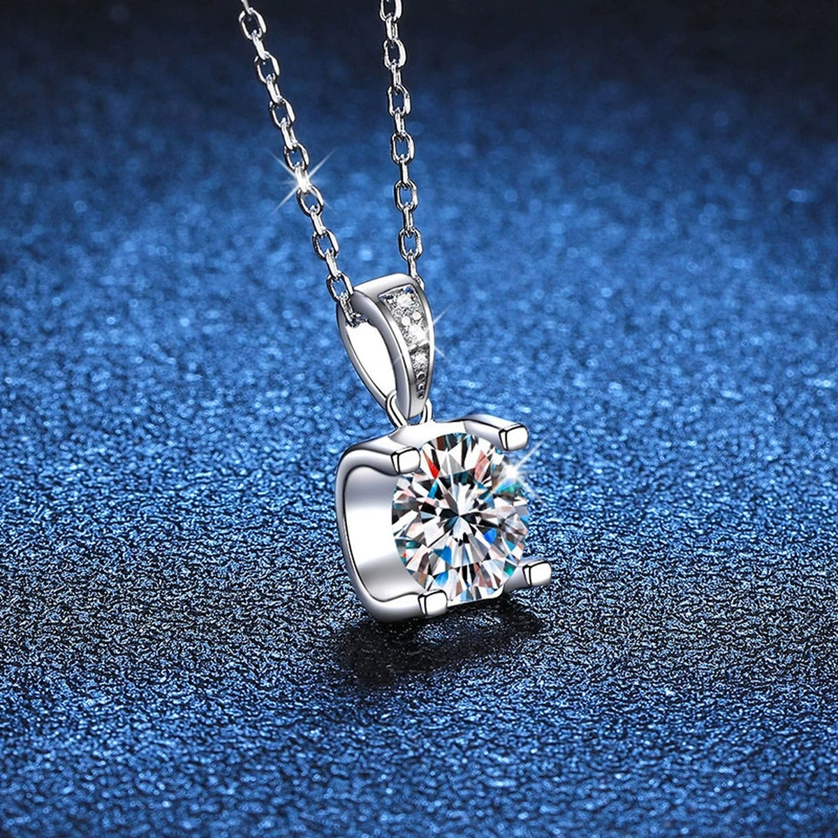 Basket-Set Round Moissanite Pendant Necklace in Platinum-Plated S925 Sterling Silver blue background close-up view