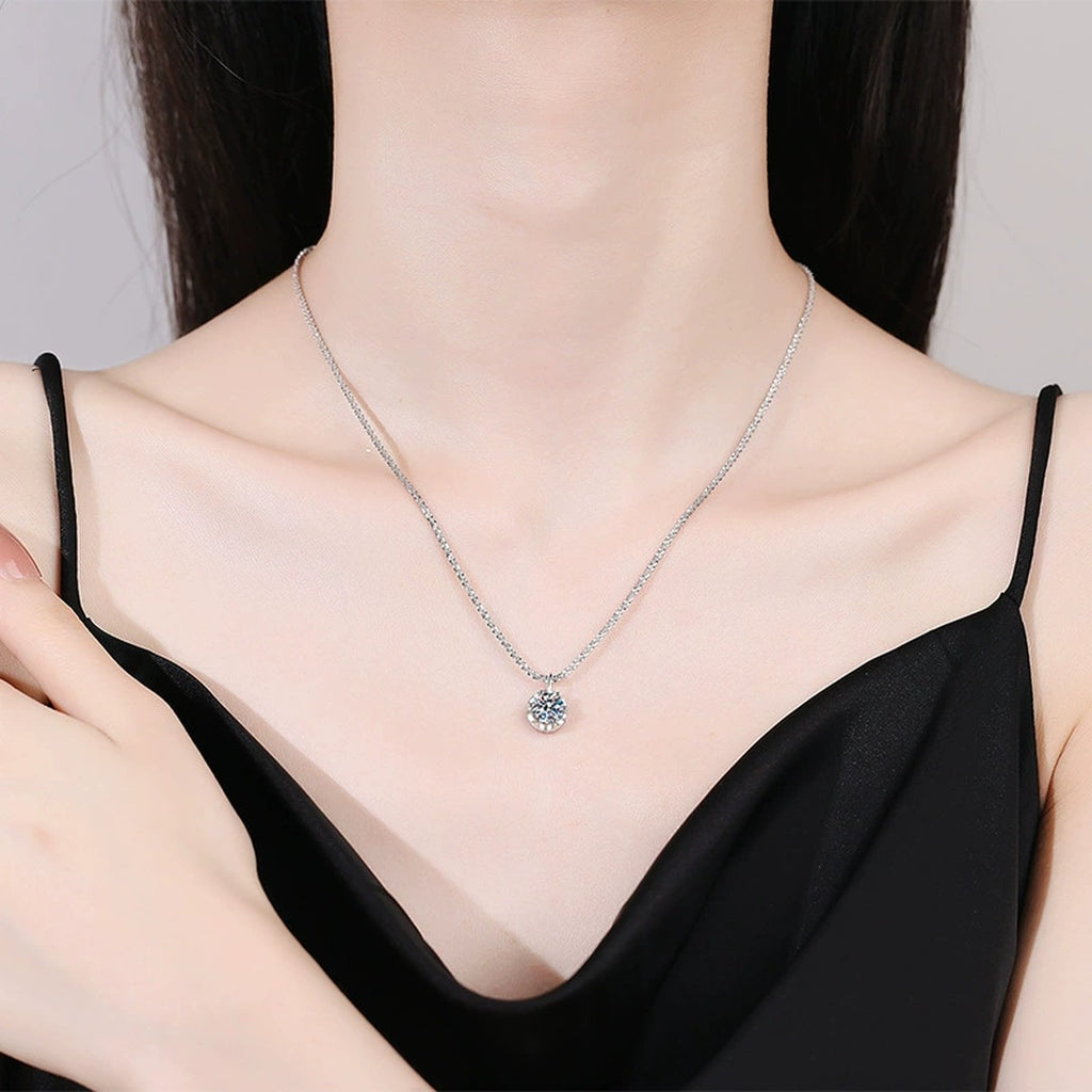 Round Bezel Halo Moissanite Pendant Necklace in Platinum-Plated S925 Sterling Silver worn on neckline by model