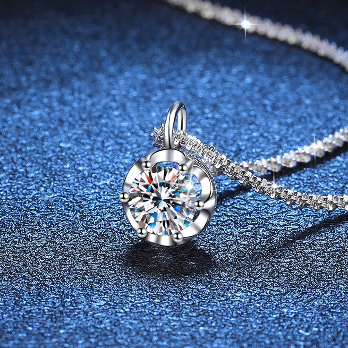 Round Bezel Halo Moissanite Pendant Necklace in Platinum-Plated S925 Sterling Silver blue background close-up view