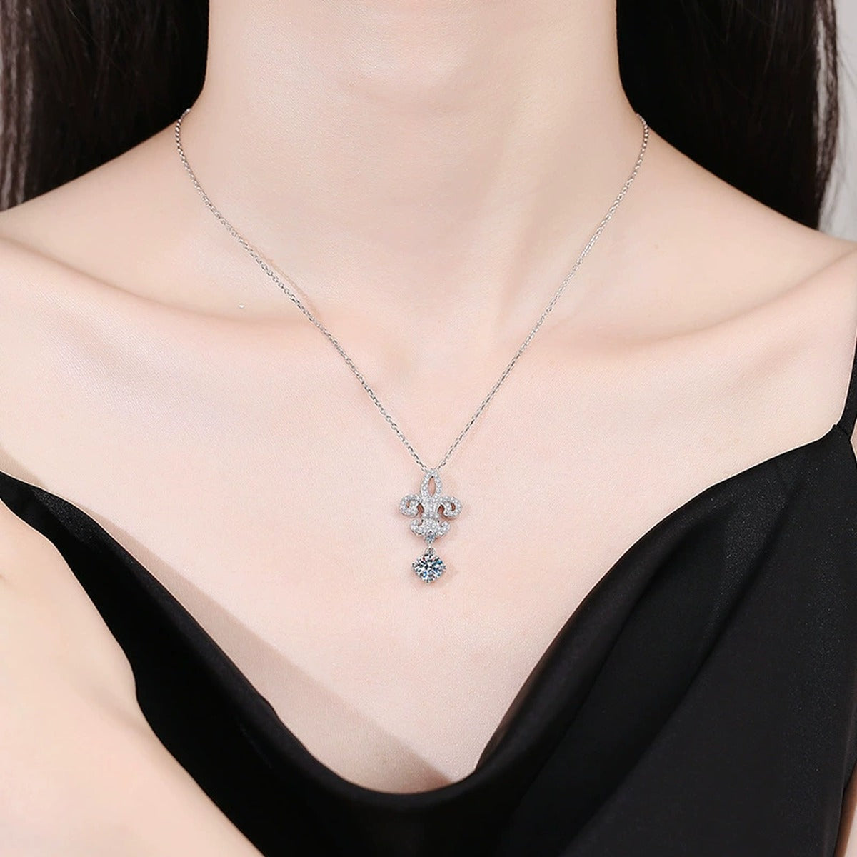 Fleur-De-Lis Moissanite Drop Necklace in Platinum-Plated S925 Sterling Silver worn on neckline by model