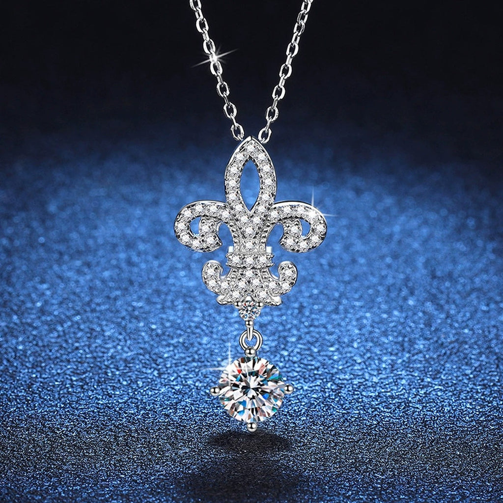 Fleur-De-Lis Moissanite Drop Necklace in Platinum-Plated S925 Sterling Silver blue background angled detail view