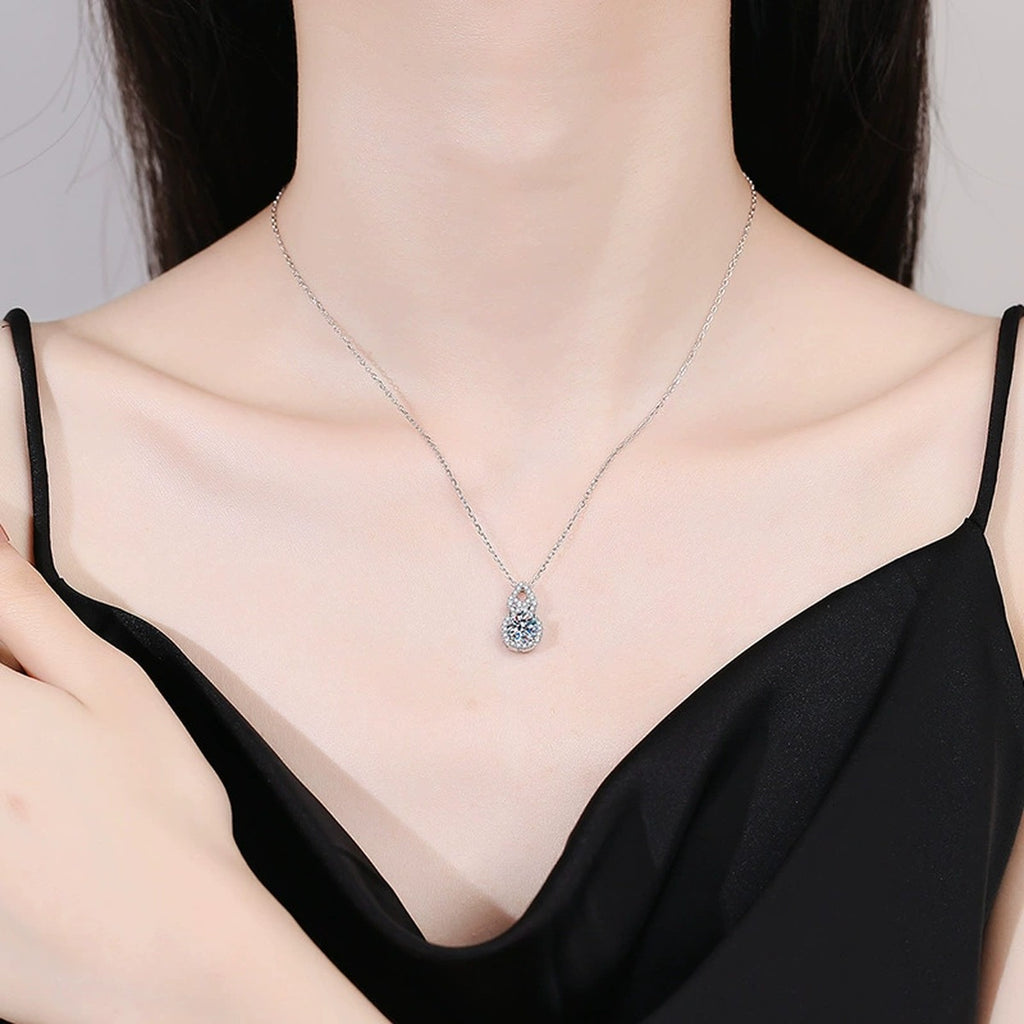 Pear Halo Moissanite Drop Necklace in Platinum-Plated S925 Sterling Silver worn on neckline by model