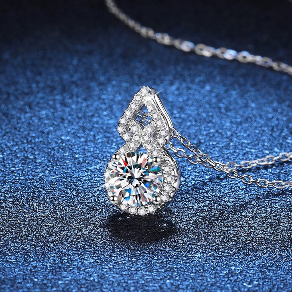 Pear Halo Moissanite Drop Necklace in Platinum-Plated S925 Sterling Silver blue background close-up view
