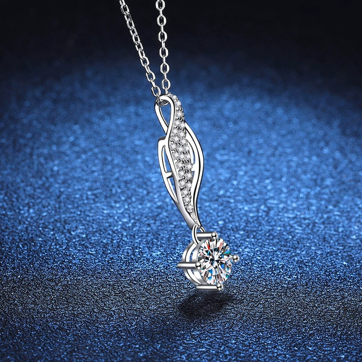 Curved Leaf Moissanite Drop Necklace in Platinum-Plated S925 Sterling Silver blue background angled detail view