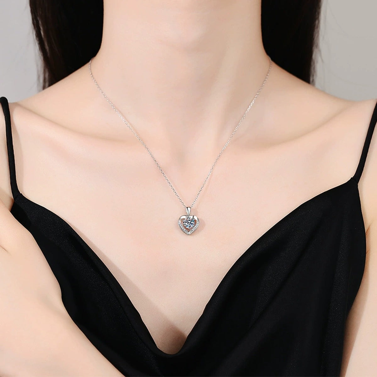 Heart Halo Moissanite Pendant Necklace in Platinum-Plated S925 Sterling Silver worn on neckline by model