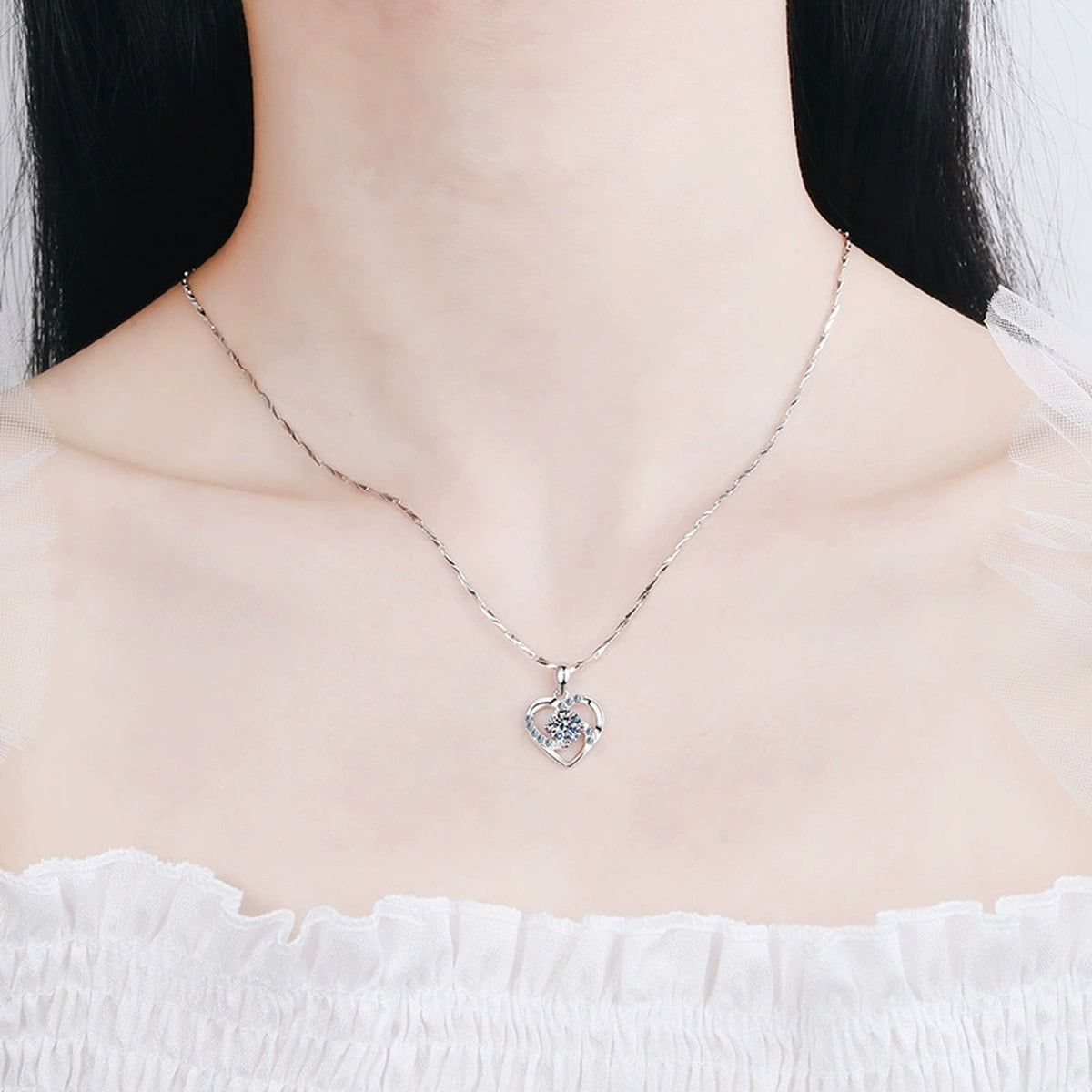 Heart Halo Moissanite Pendant Necklace in Platinum-Plated S925 Sterling Silver worn on neckline by model