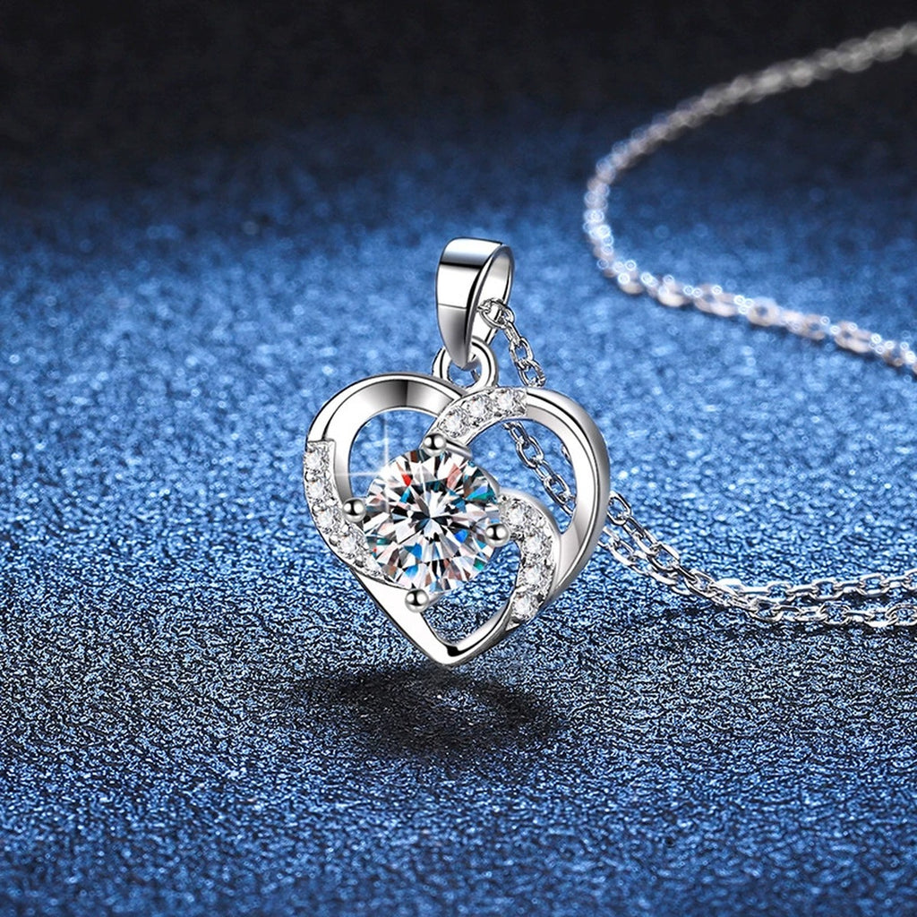 Heart Halo Moissanite Pendant Necklace in Platinum-Plated S925 Sterling Silver blue background angled detail view