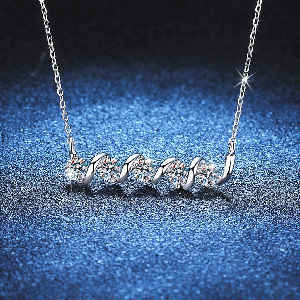 Graduated Five-Stone Moissanite Station Necklace in Platinum-Plated S925 Sterling Silver blue background angled detail view