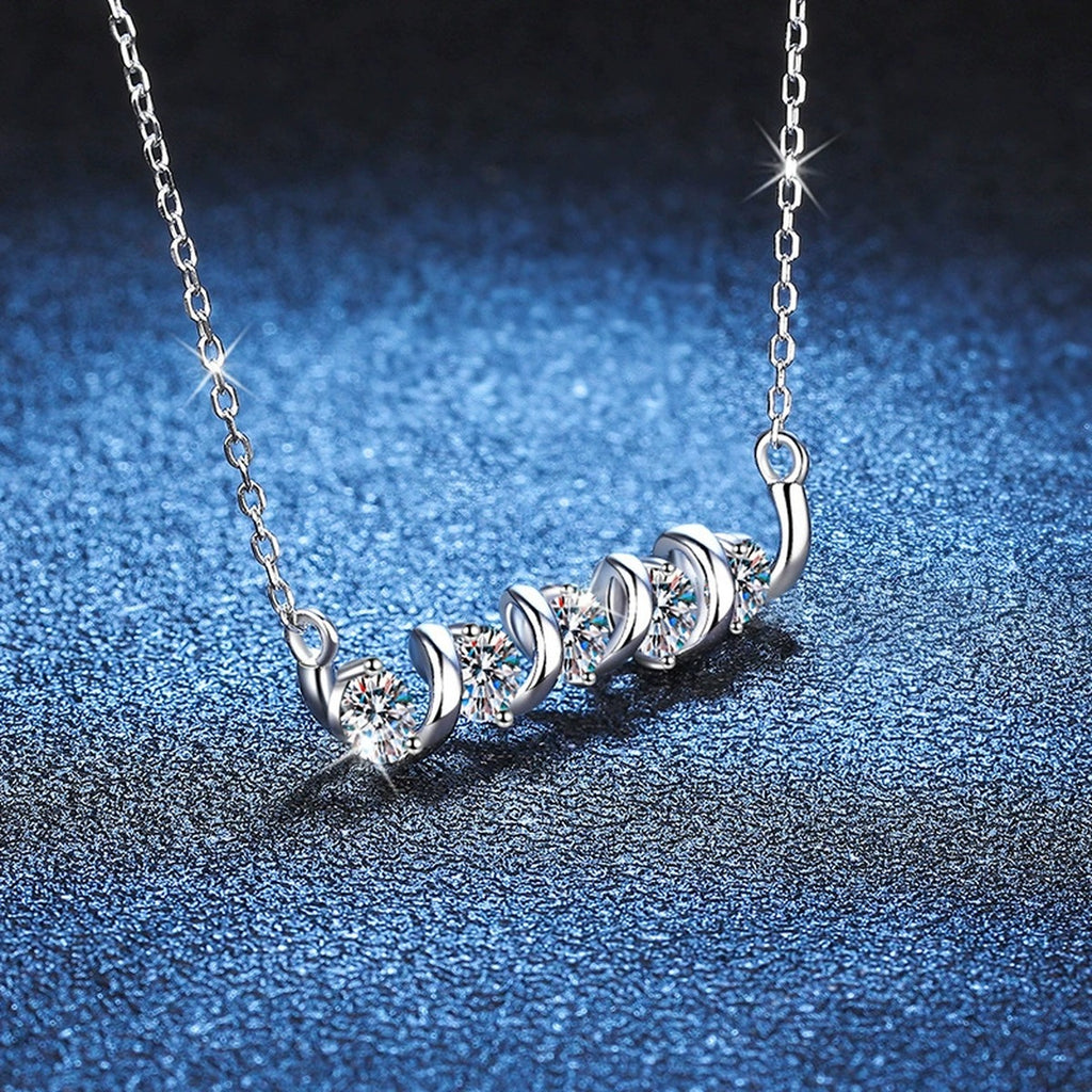 Graduated Five-Stone Moissanite Station Necklace in Platinum-Plated S925 Sterling Silver blue background close-up view