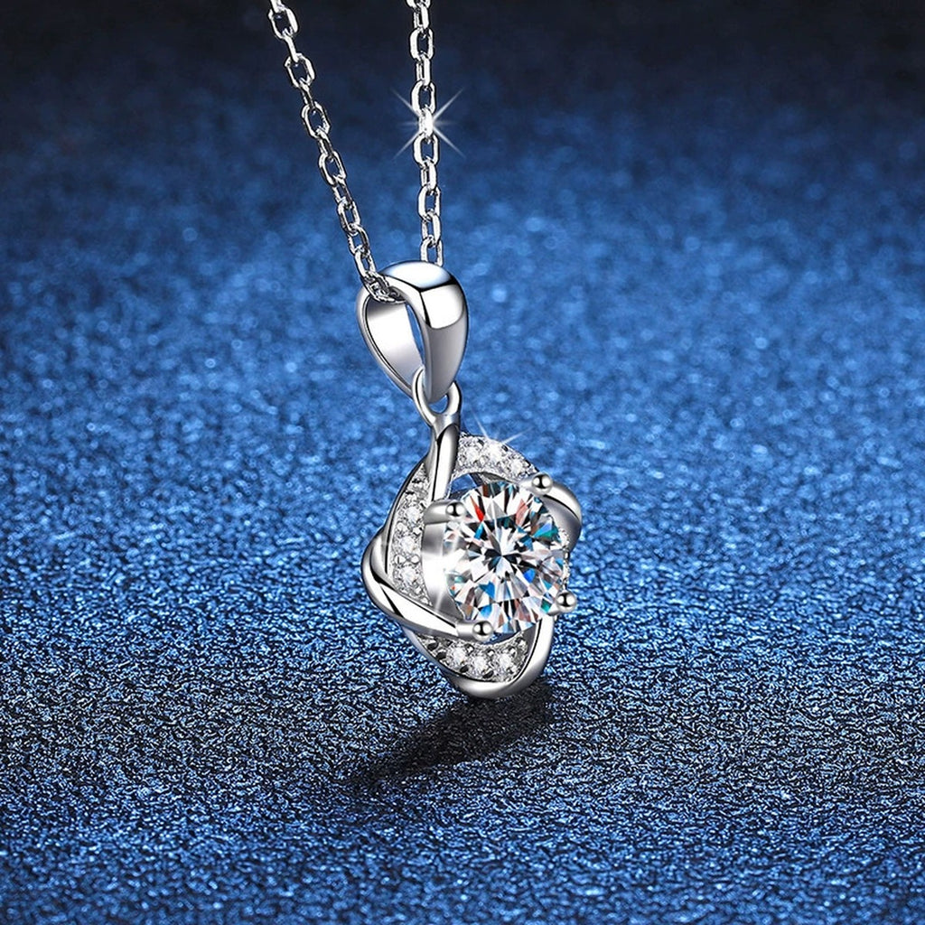 Round Quatrefoil Halo Moissanite Pendant Necklace in Platinum-Plated S925 Sterling Silver blue background close-up view