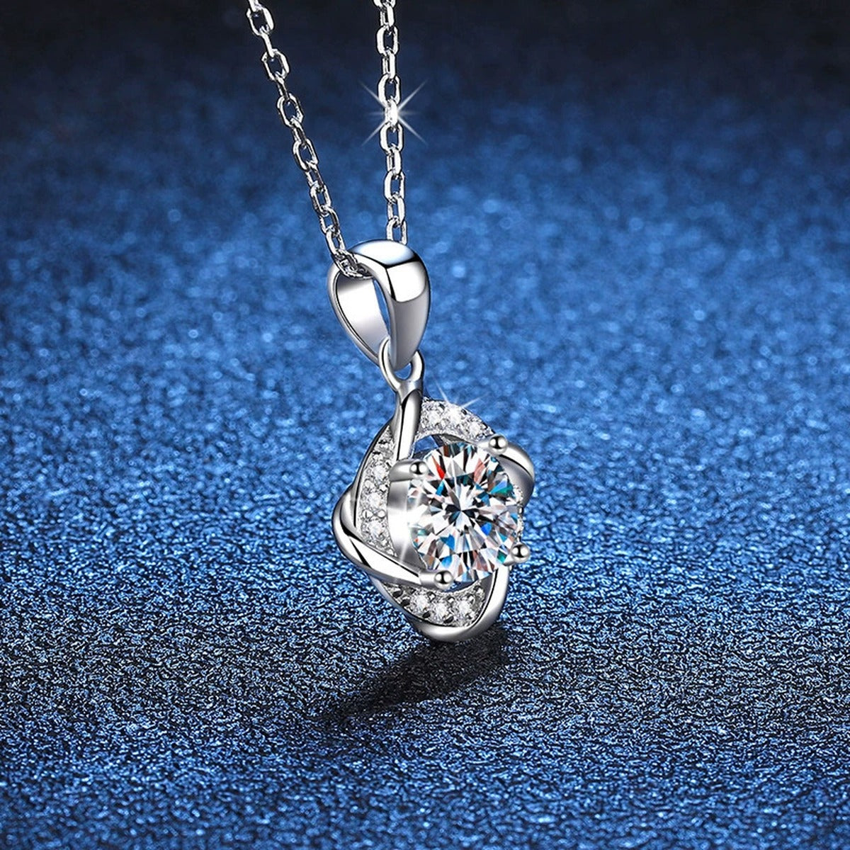 Round Quatrefoil Halo Moissanite Pendant Necklace in Platinum-Plated S925 Sterling Silver blue background close-up view