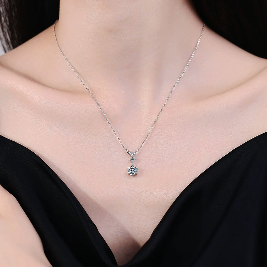Chevron Drop Moissanite Necklace in Platinum-Plated S925 Sterling Silver worn on neckline by model