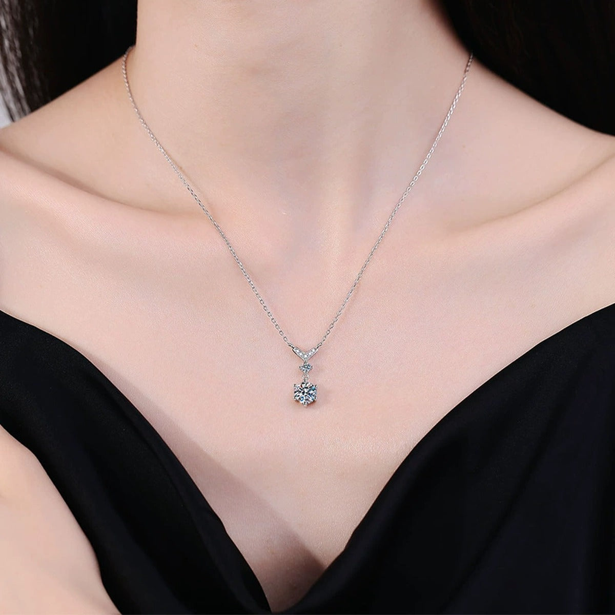 Chevron Drop Moissanite Necklace in Platinum-Plated S925 Sterling Silver worn on neckline by model