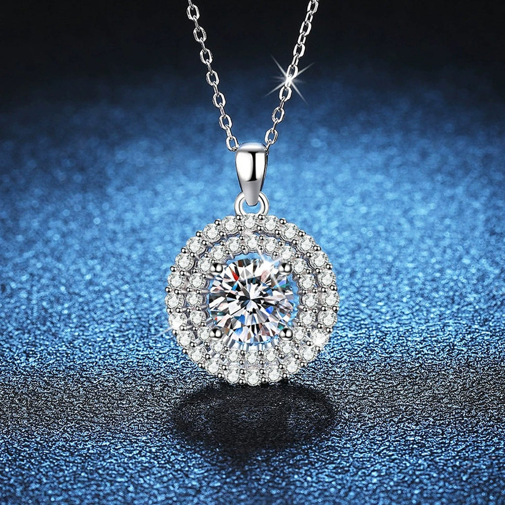 Double Halo Round Moissanite Pendant Necklace in Platinum-Plated S925 Sterling Silver blue background close-up view