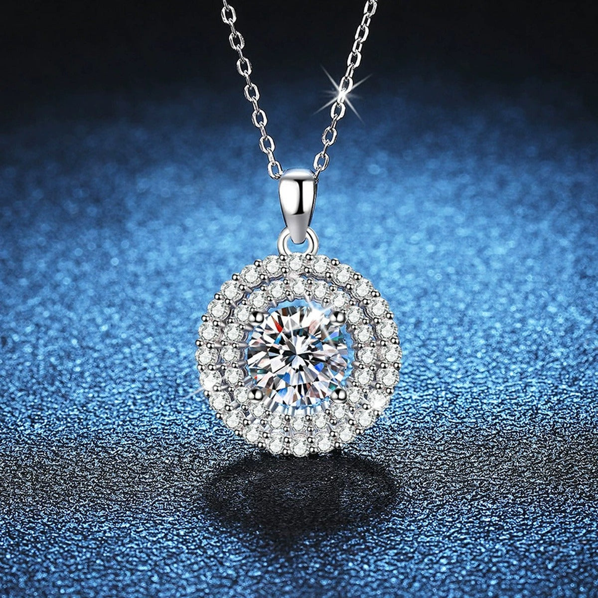 Double Halo Round Moissanite Pendant Necklace in Platinum-Plated S925 Sterling Silver blue background close-up view