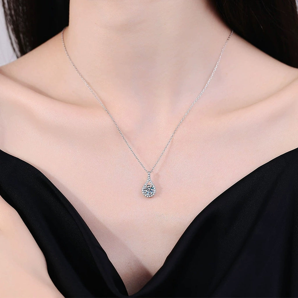 Pear Halo Moissanite Pendant Necklace in Platinum-Plated S925 Sterling Silver worn on neckline by model