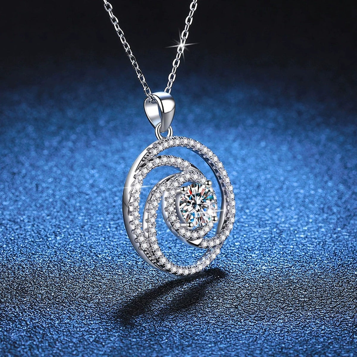 Spiral Halo Moissanite Pendant Necklace in Platinum-Plated S925 Sterling Silver blue background angled detail view
