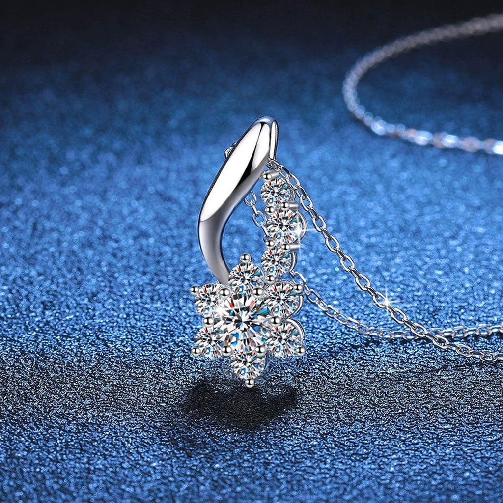 Starburst Moissanite Drop Necklace in Platinum-Plated S925 Sterling Silver blue background angled detail view
