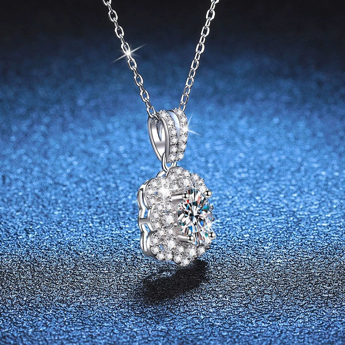 Cushion Halo Pear Moissanite Pendant Necklace in Platinum-Plated S925 Sterling Silver blue background close-up view
