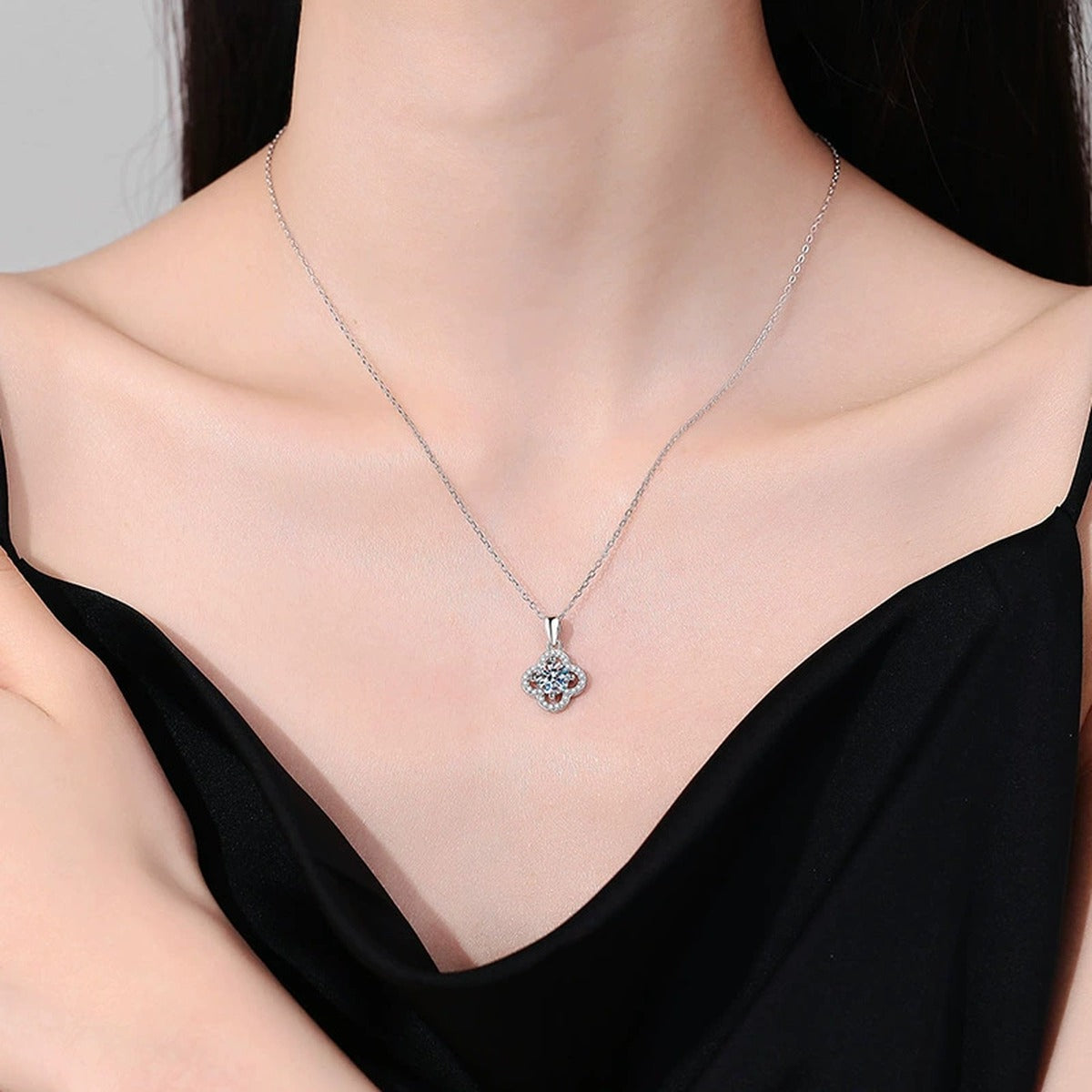 Four-Leaf Clover Halo Moissanite Pendant Necklace in Platinum-Plated S925 Sterling Silver worn on neckline by model