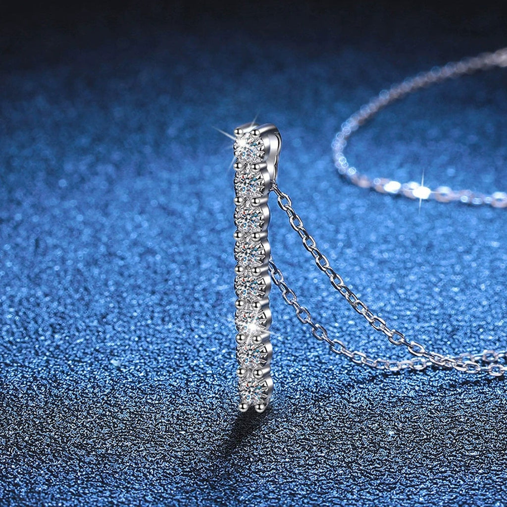 Slim Bar Moissanite Drop Necklace in Platinum-Plated S925 Sterling Silver blue background close-up view