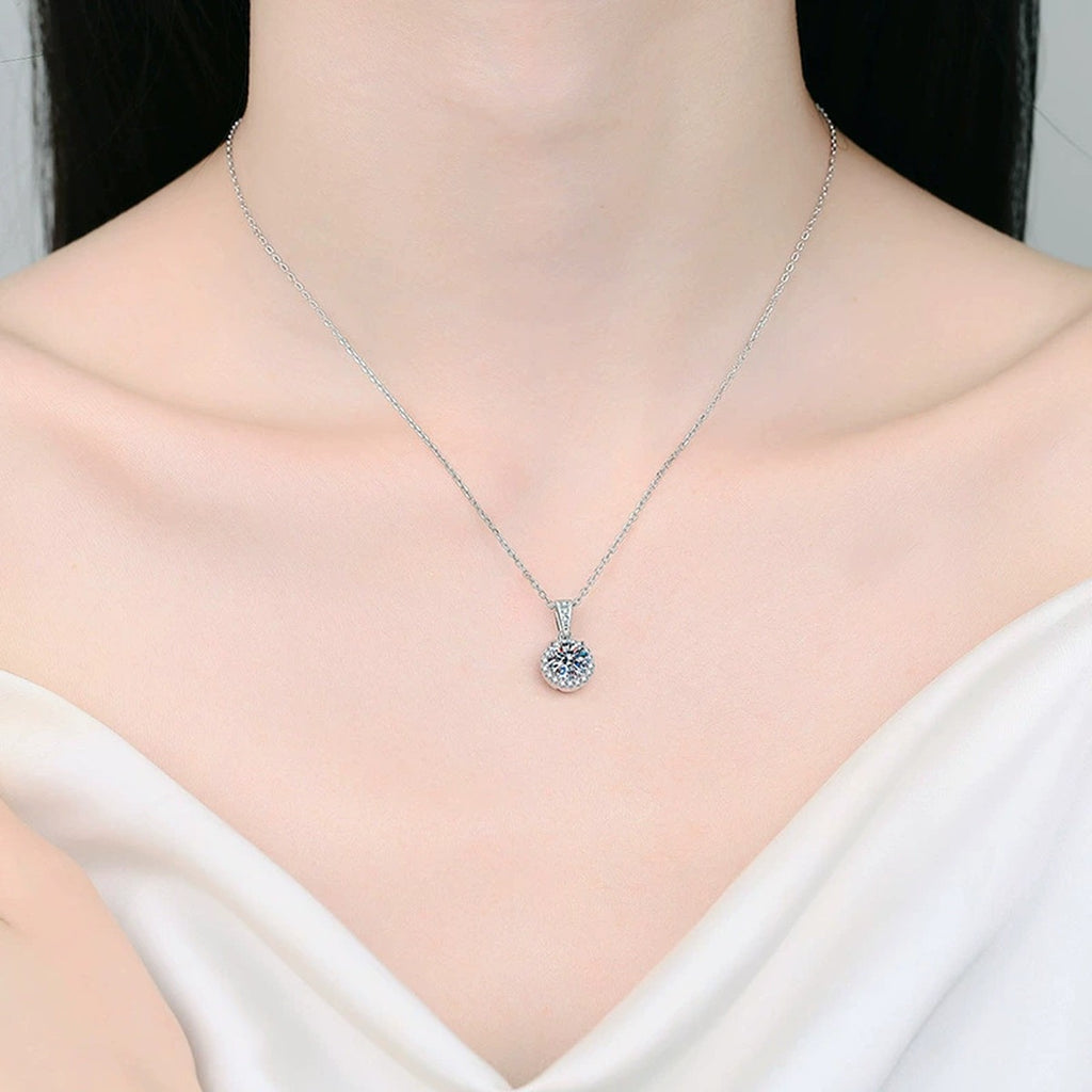Round Halo Moissanite Pendant Necklace in Platinum-Plated S925 Sterling Silver worn on neckline by model