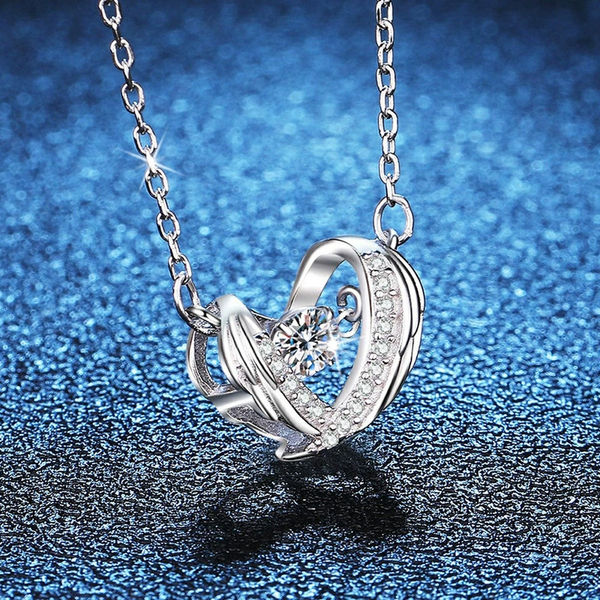 Ribbon Heart Moissanite Pendant Necklace in Platinum-Plated S925 Sterling Silver blue background product view